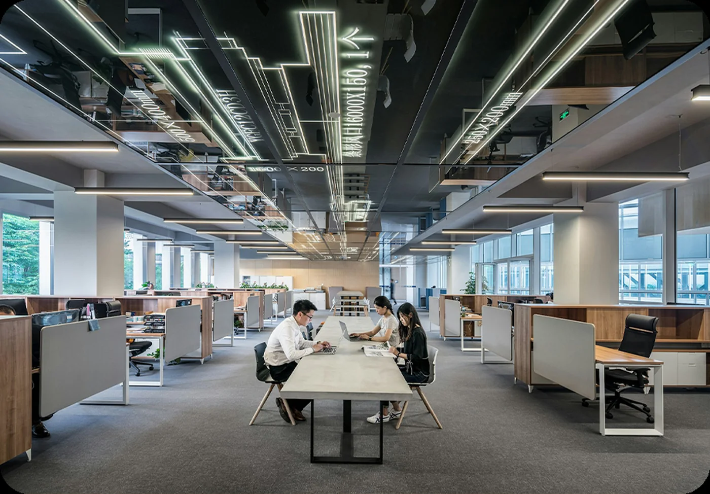 Open office space with visible ceiling ventilation paths